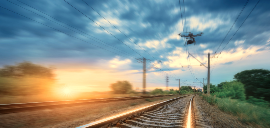 A drone flying over a railroad track